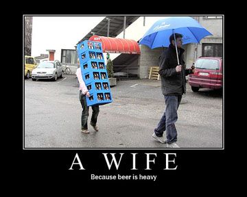 Poster: a man strolls under an umbrella while a woman carries a huge crate of beer bottles. Caption: A wife. Because beer is heavy.